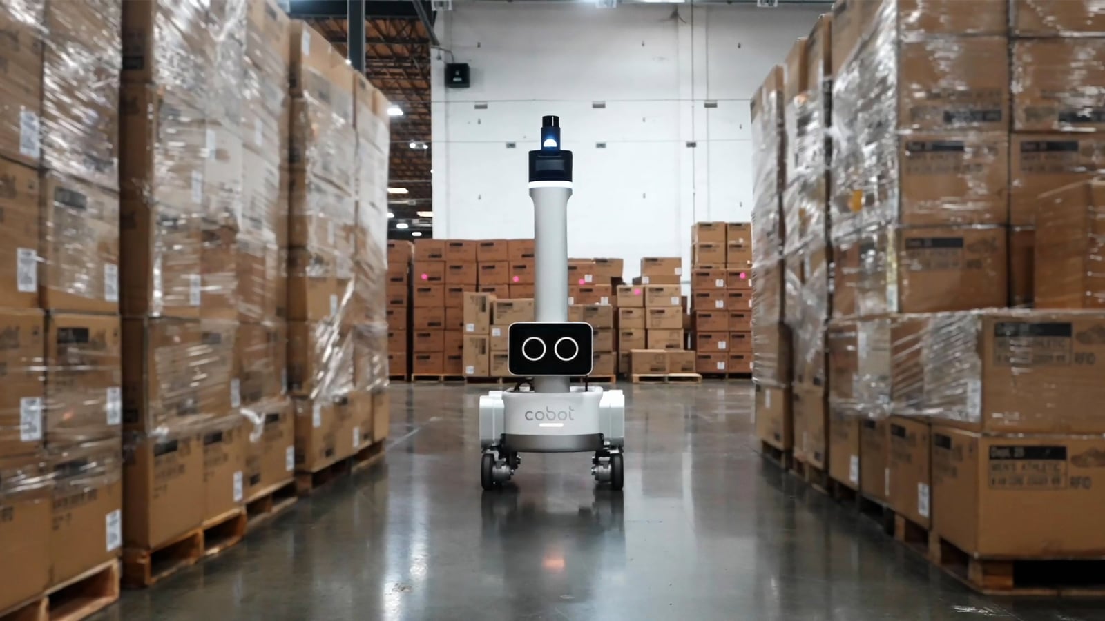 Cobot: the Cobot warehouse robot navigating a pallet aisle