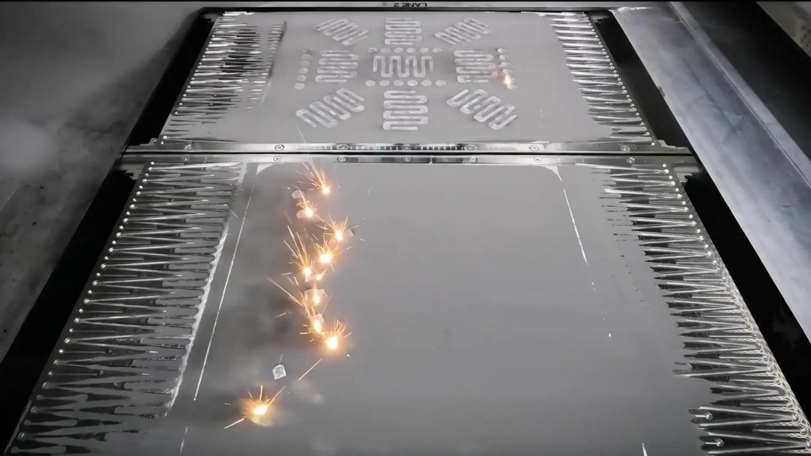 Freeform: sparks flying off a sheet-metal press
