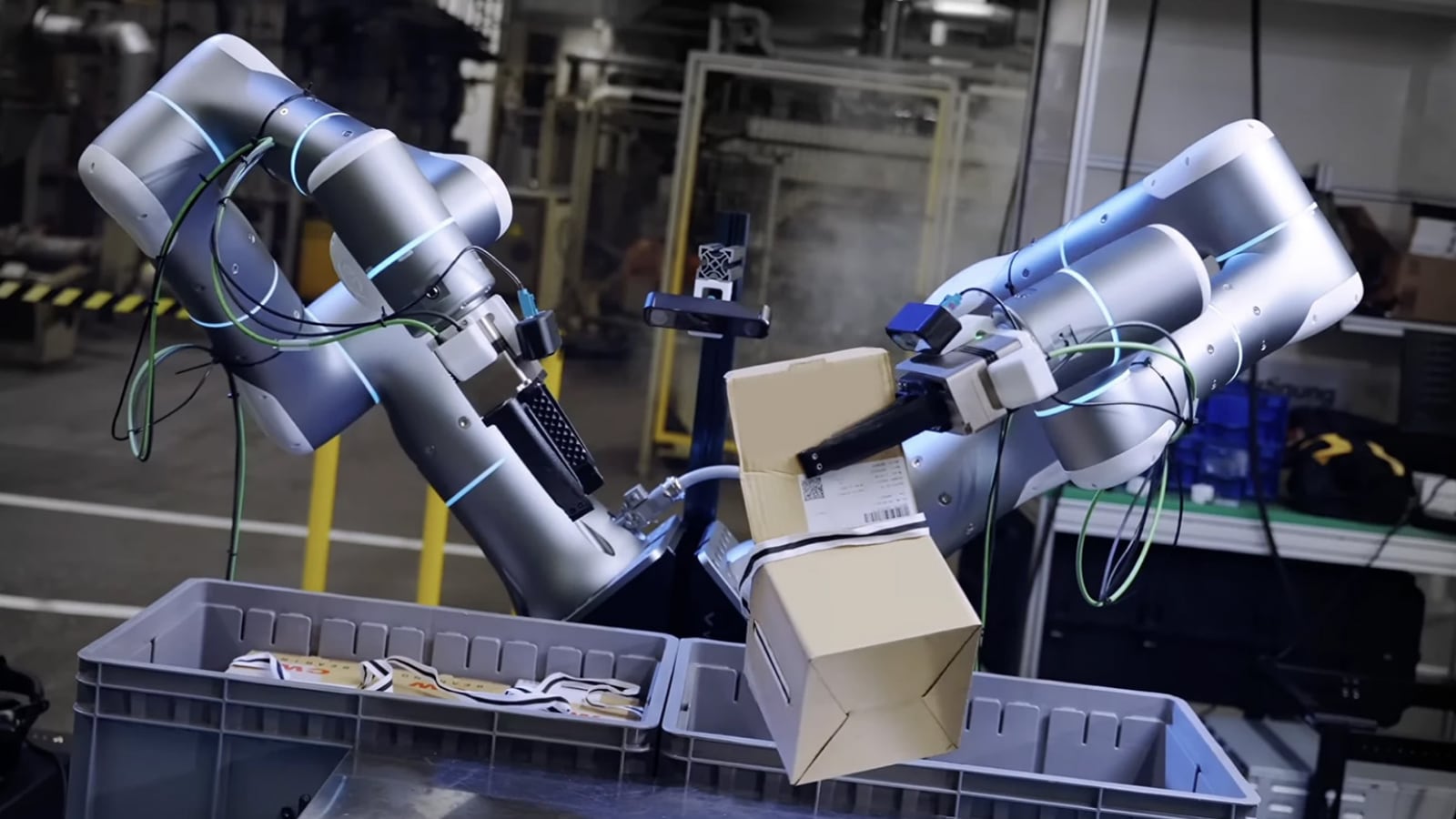 Rhoda AI: a robotic arm sorting packages in a warehouse